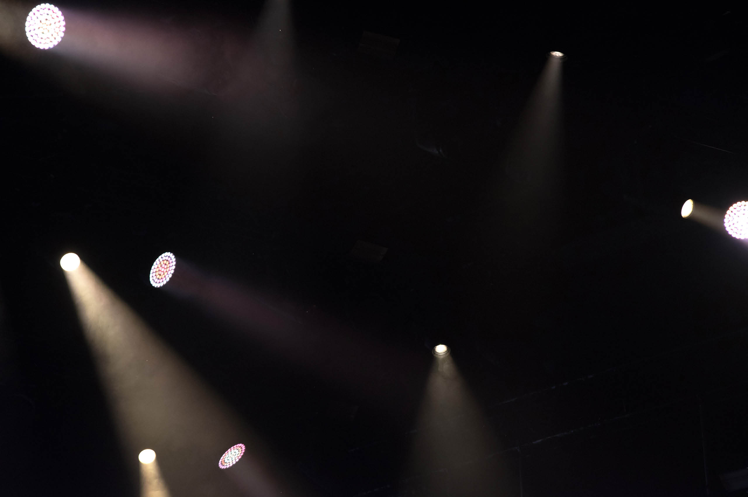 Stage lights glowing in the dark. Live music festival concept background