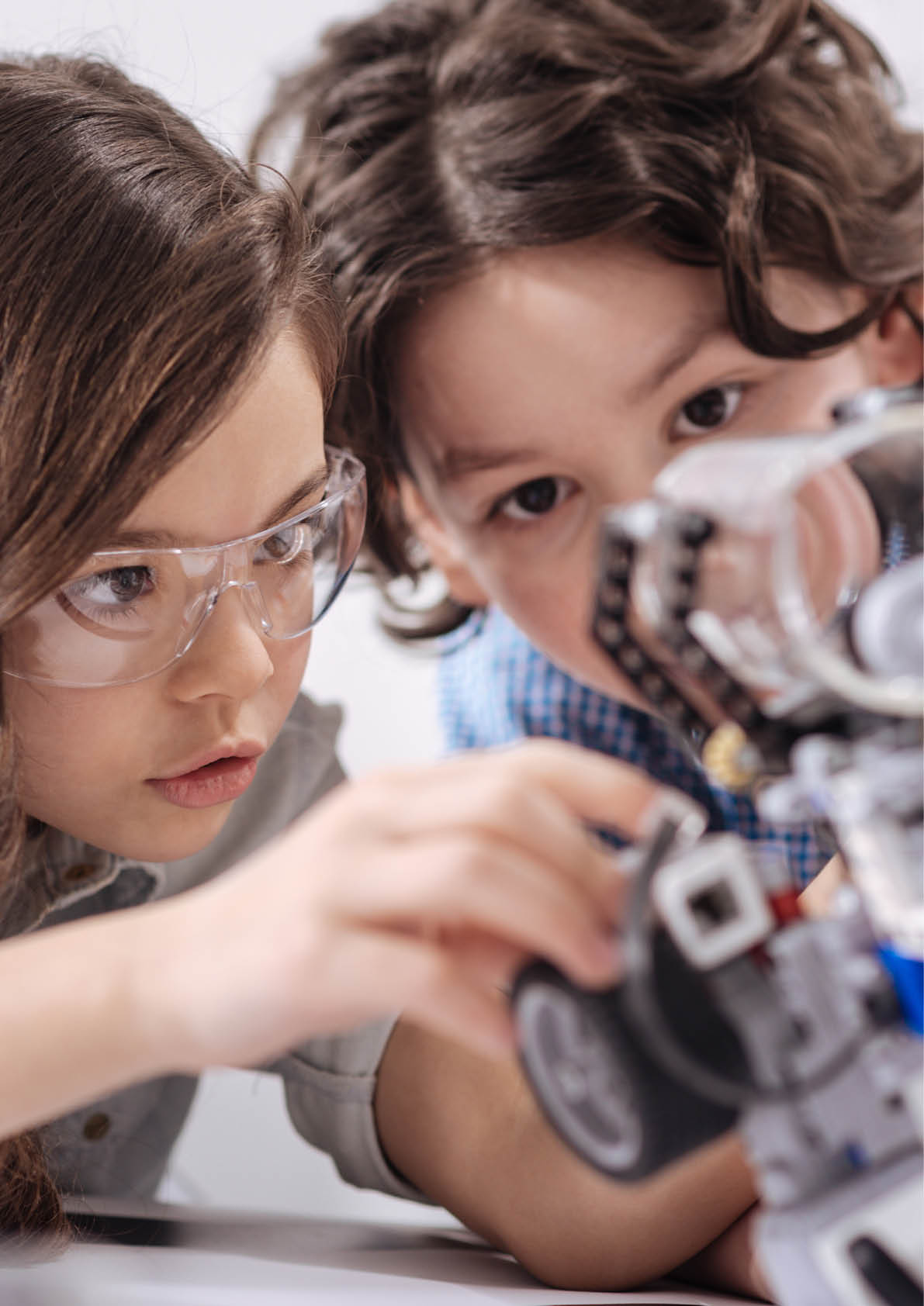 Inventive kids enjoying science lesson at school
