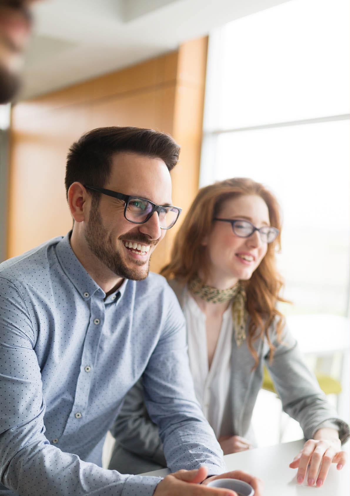 Business people having fun and chatting at workplace office