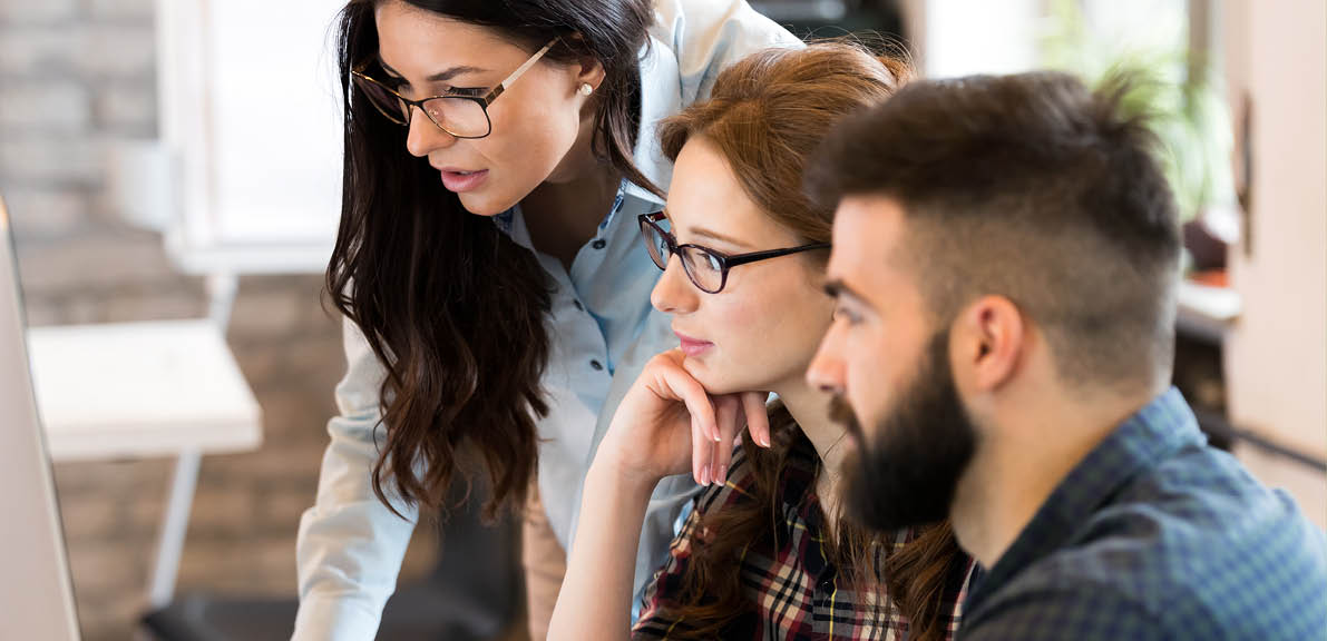 Young architects working on project in office together