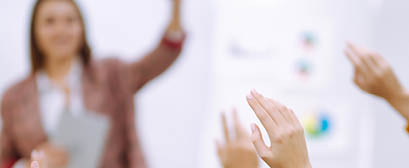 Business people raising hand up to ask question with speaker