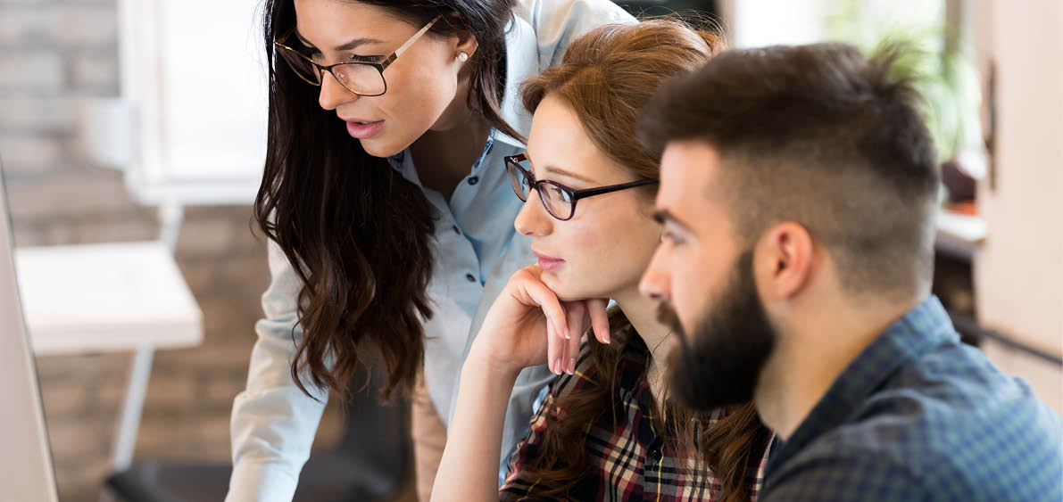 Young architects working on project in office together