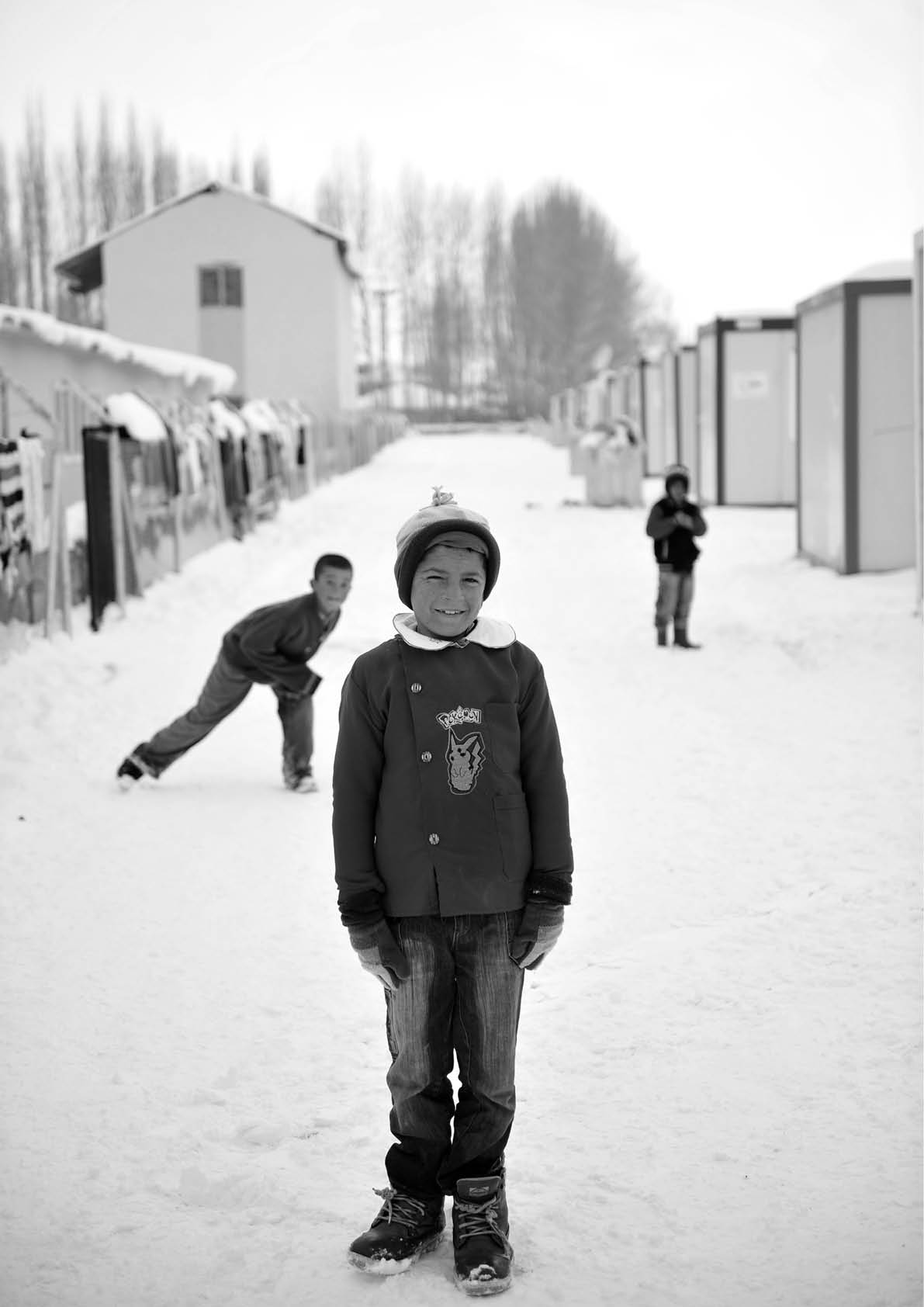 VAN, TURKEY - JAN 25: Earthquake victim children tent city. They play in the yard of the temporary school at the earthquake of Van-Ercis on January 25, 2012 in Van, Turkey.