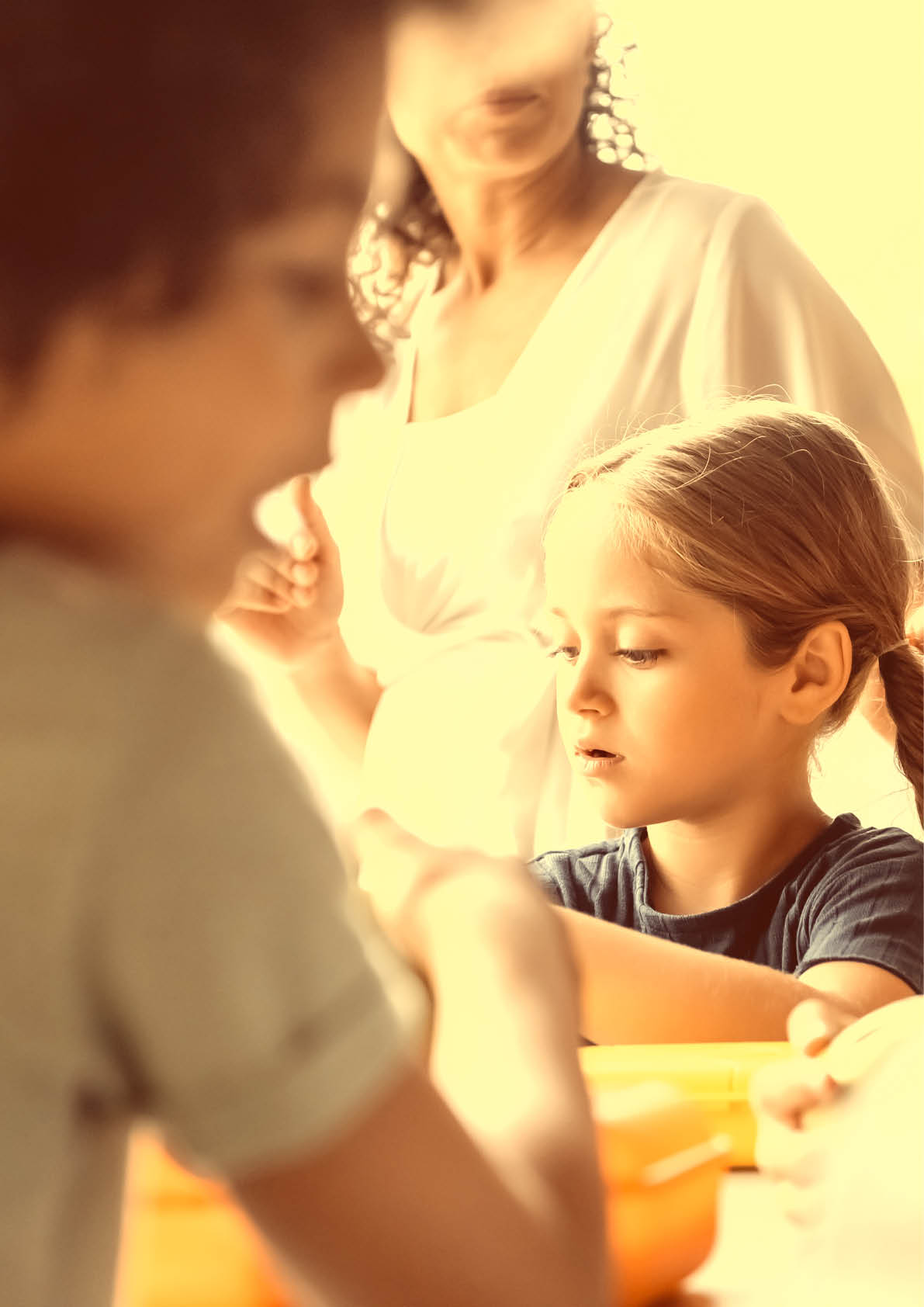 selective focus of schoolgirl near blurred interracial kids and african american teacher