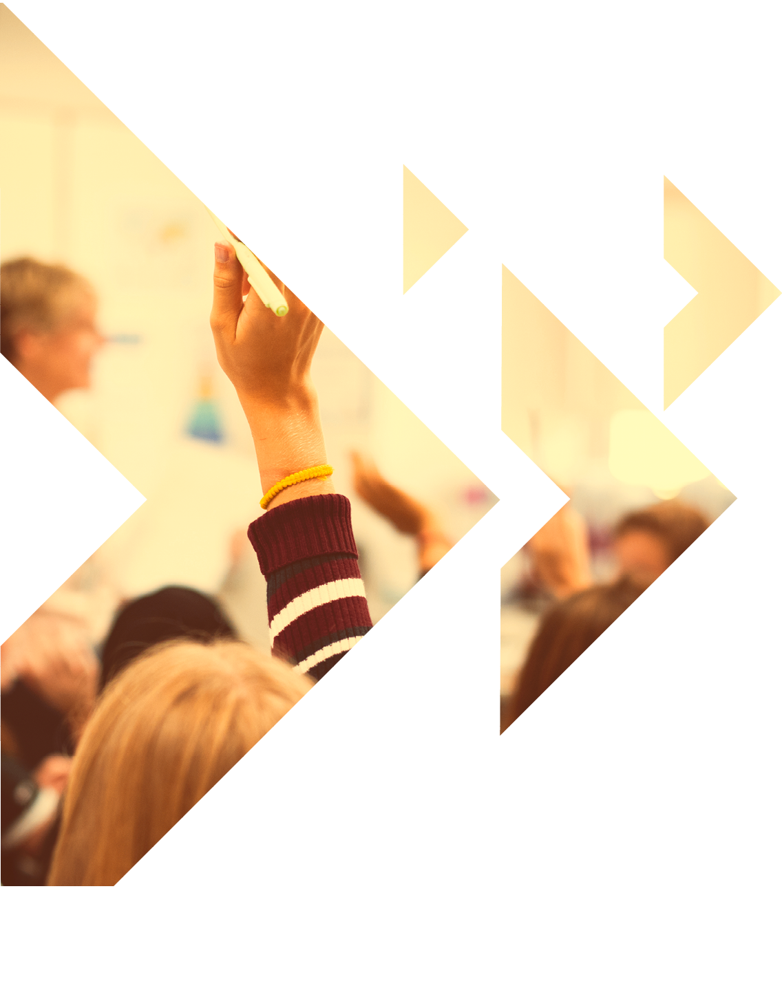 Students with their hands up responding to their teacher