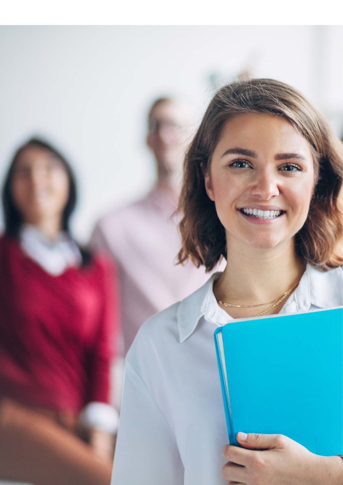 Woman standing in front of her team