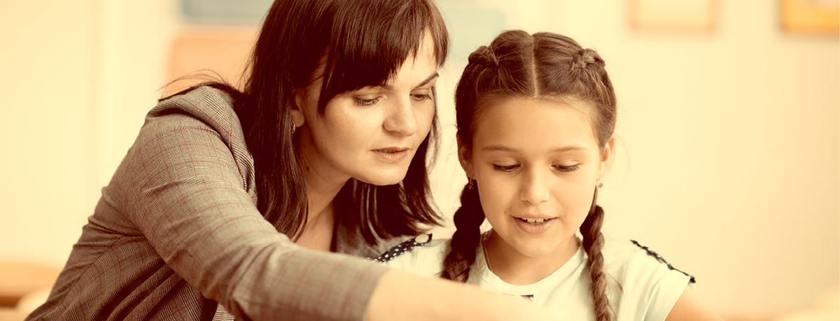 Yong beautiful teacher with schoolgirl school at klassroom
