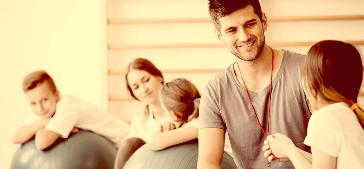 Trainers watching over the kids during physical education classes