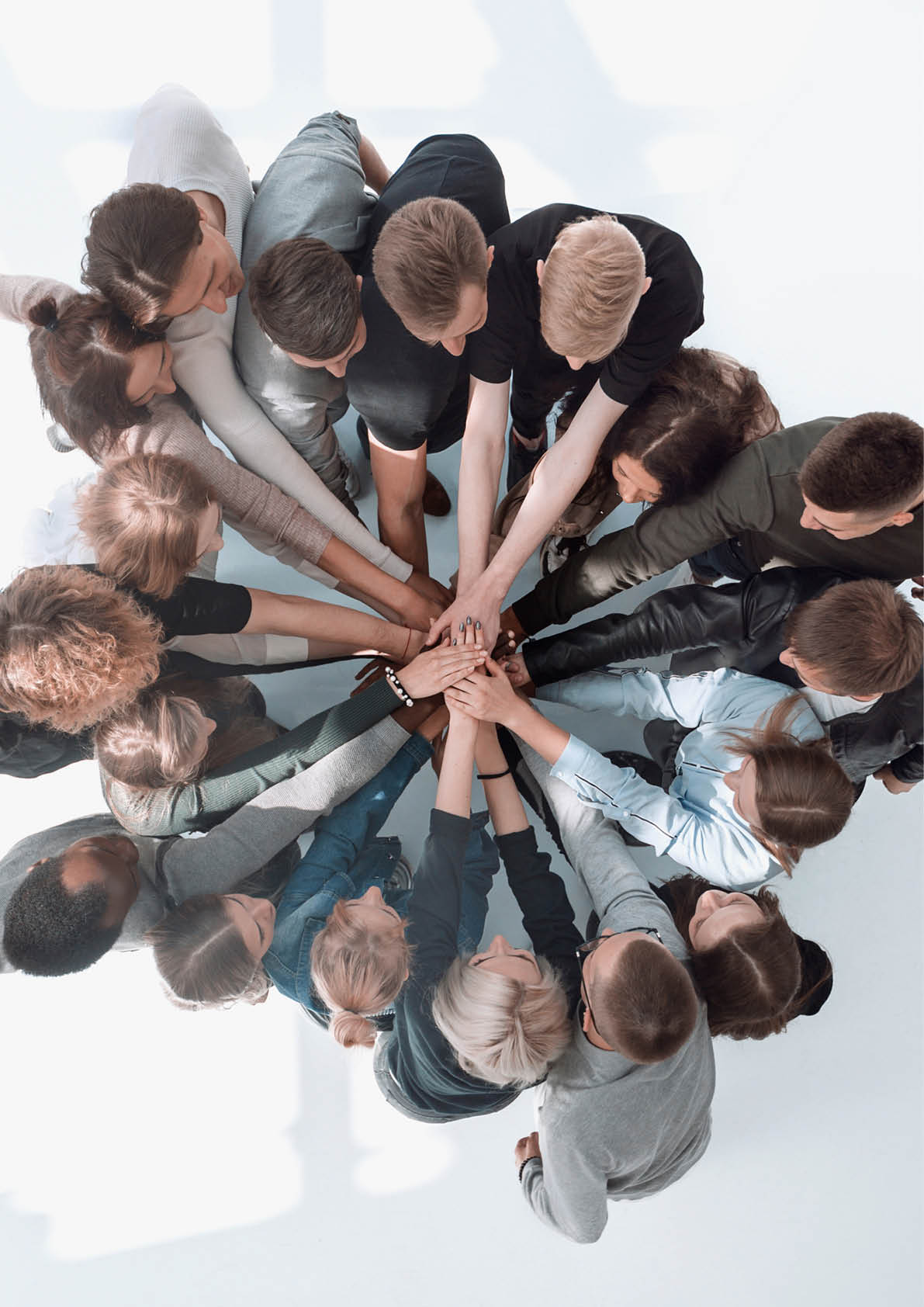 top view . a group of diverse young people showing their unity .