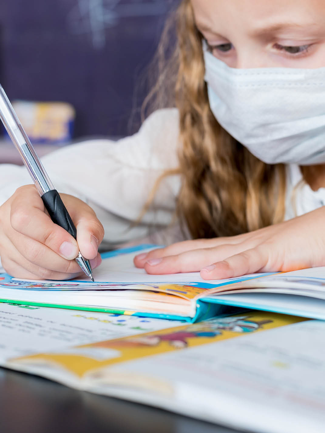 Children with face mask back at school after covid-19 quarantine and lockdown.